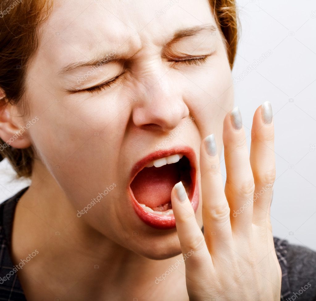 Sleepy tired woman making a big yawn