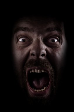 Scream of scared spooky man in dark clipart