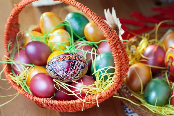 Easter painted eggs in a basket — Stock Photo, Image