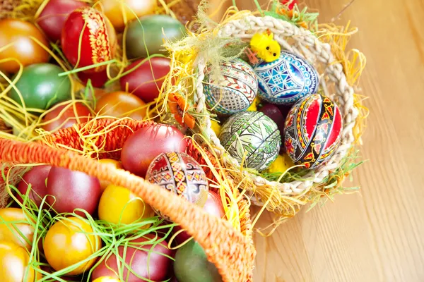 Easter painted eggs in traditional basket — Stock Photo, Image