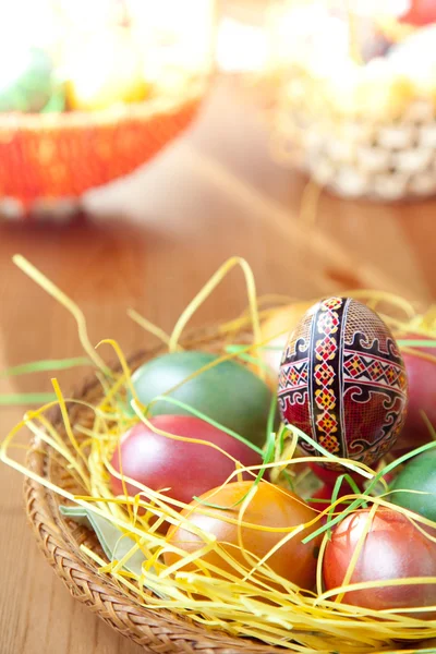 Easter painted eggs on traditional seasonal table — Stock Photo, Image