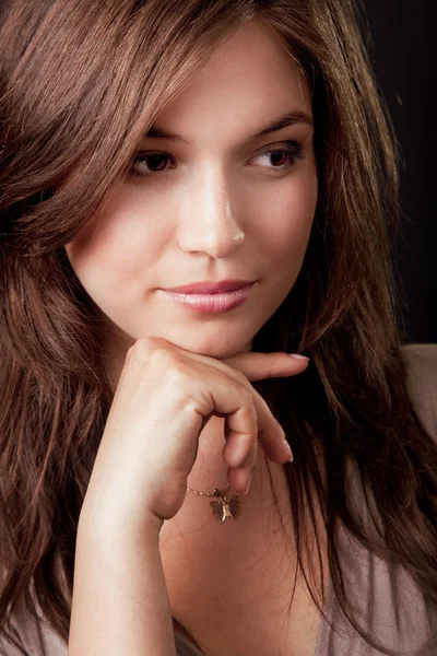 Pensive beautiful young brunette woman — Stock Photo, Image