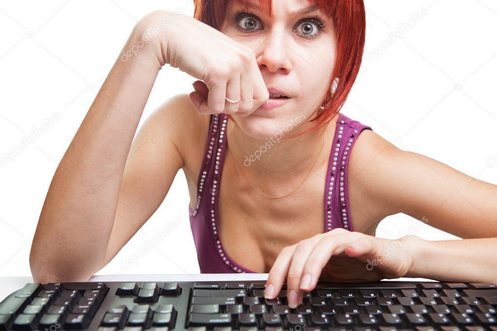 Angry woman on computer surfing the internet