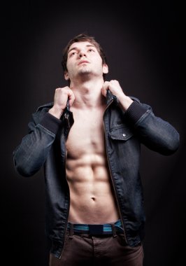 Fashion shot of sexy man with fit abs clipart