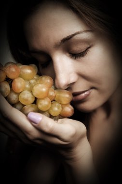 Healthy nutrition - woman with fresh grapes clipart