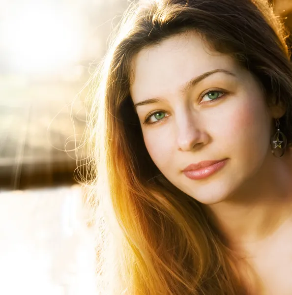 Sunlight and one beautiful sensual young woman — Stock Photo, Image