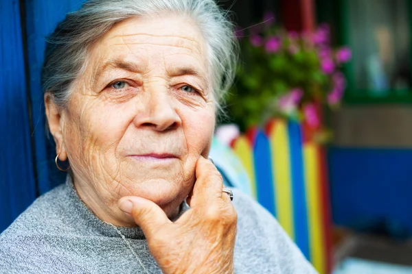 Portrait of one content old senior woman — Stock Photo, Image