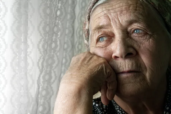 Sad lonely pensive old senior woman — Stock Photo, Image