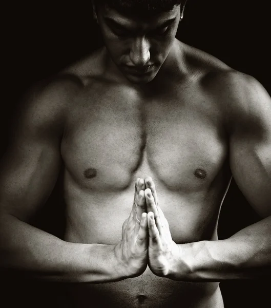 Spiritual concentration - muscular man doing yoga — Stock Photo, Image