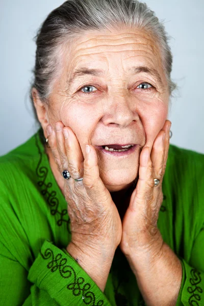 Happy and amazed old senior woman — Stockfoto
