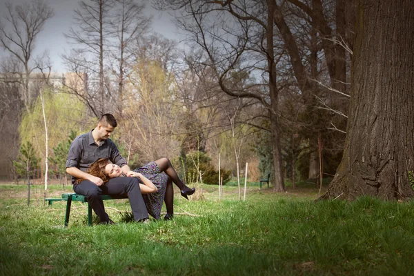 Sensual serene couple on bench — Stock Photo, Image