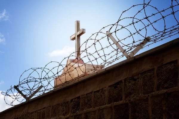 stock image War and religion concept - Cross and barbed wire