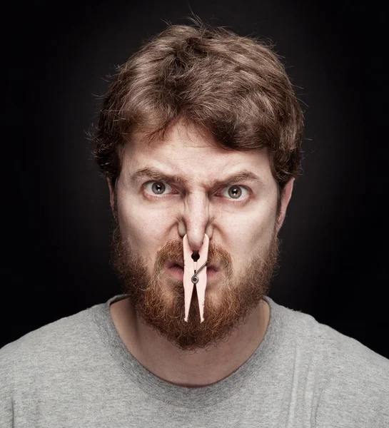 Bad smell concept - peg on male nose — Stock Photo, Image