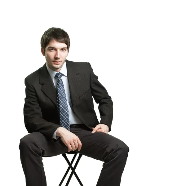 坐在椅子上的自信商人 — 图库照片