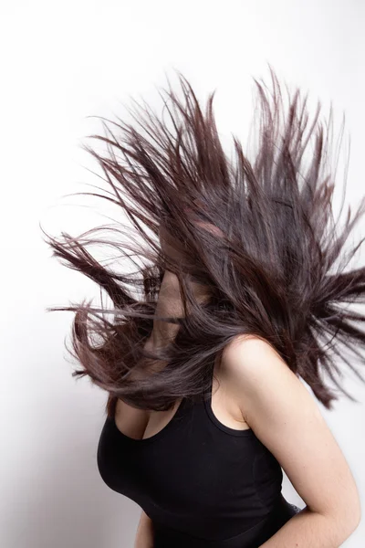 Active woman with hair in motion Stock Photo