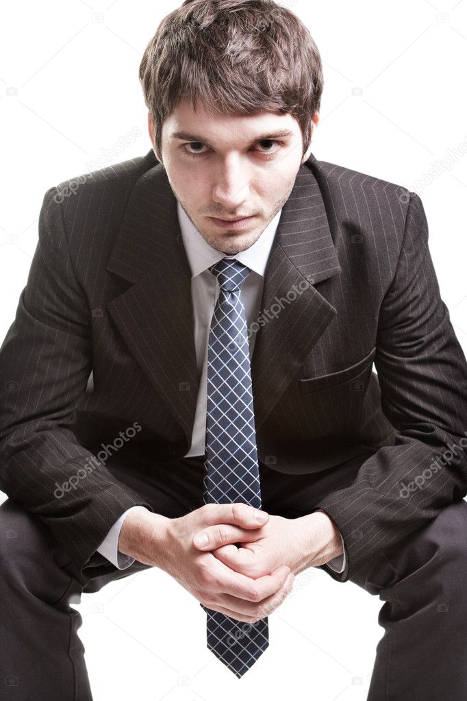 Determined young businessman over white