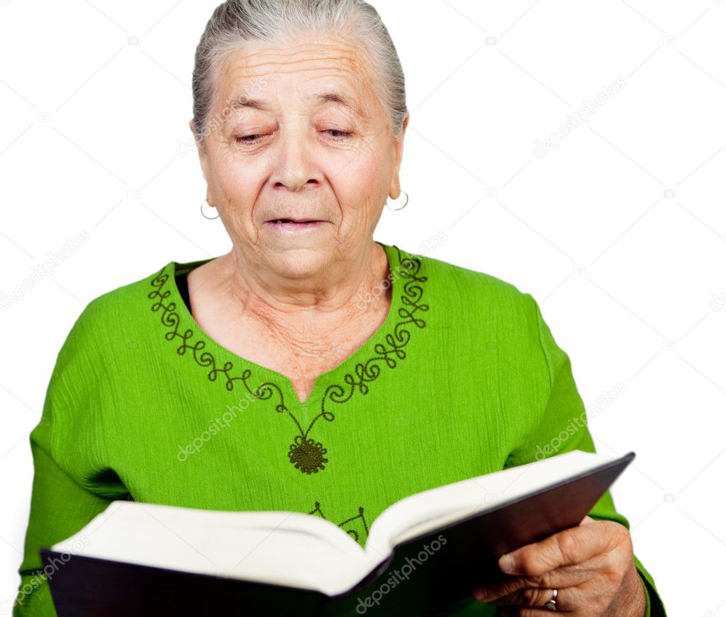 Amazed senior woman reading surprise book