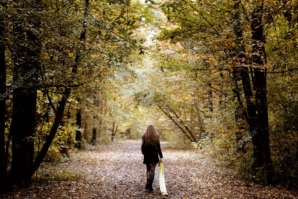 girl walking in the forest