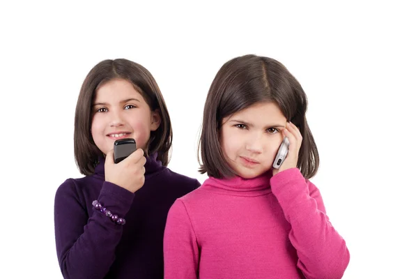 Девушки с телефонами — стоковое фото