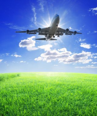 Airplane fly over grass clipart