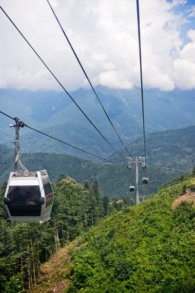 stock image Ascension to the top of the mountain in a cable car. Clouds cover the mountains.