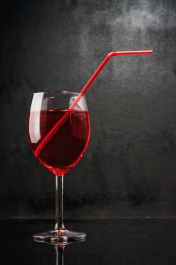 In a bar of vampires. Cocktail on the basis of blood. A glass with a red li clipart