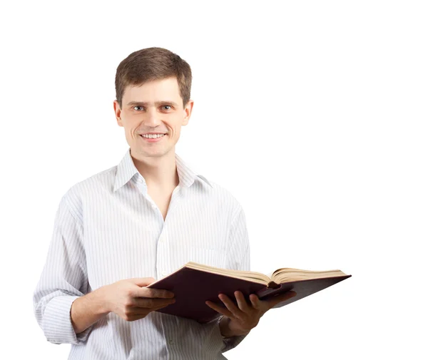 Lächelnder Mann mit aufgeschlagenem Buch vor weißem Hintergrund. — Stockfoto