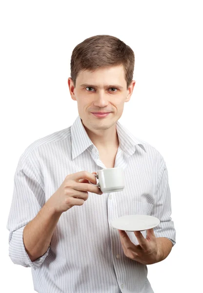 Empresário sorridente com uma chávena. Isolado sobre fundo branco — Fotografia de Stock