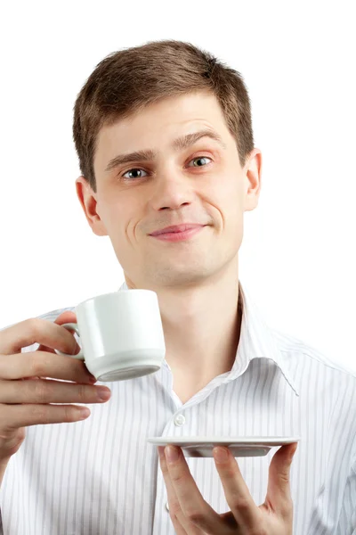 Empresário sorridente com uma chávena. Isolado sobre fundo branco — Fotografia de Stock