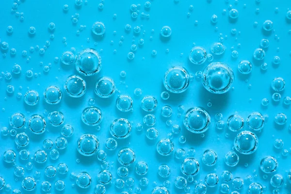 Blue abstract water with bubbles. Macro. Closeup. — Stock Photo, Image