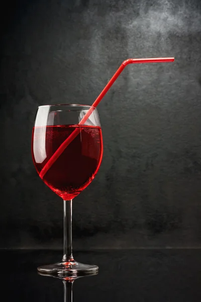 In a bar of vampires. Cocktail on the basis of blood. A glass with a red li — Stock Photo, Image