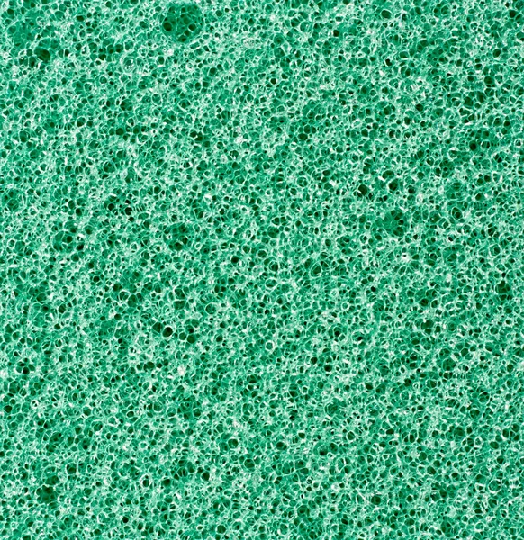 Groene textuur schuim spons. achtergrond. — Stockfoto