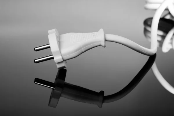 Abstract white europe standard power plug over black background — Stock Photo, Image