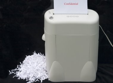 Cnfidential information being shredded clipart