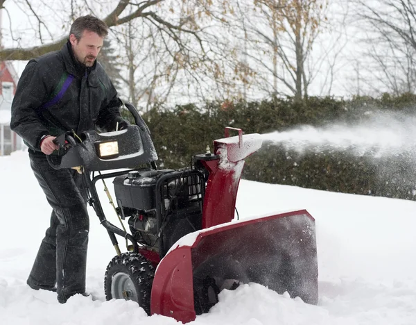 stock image Man using snow blower