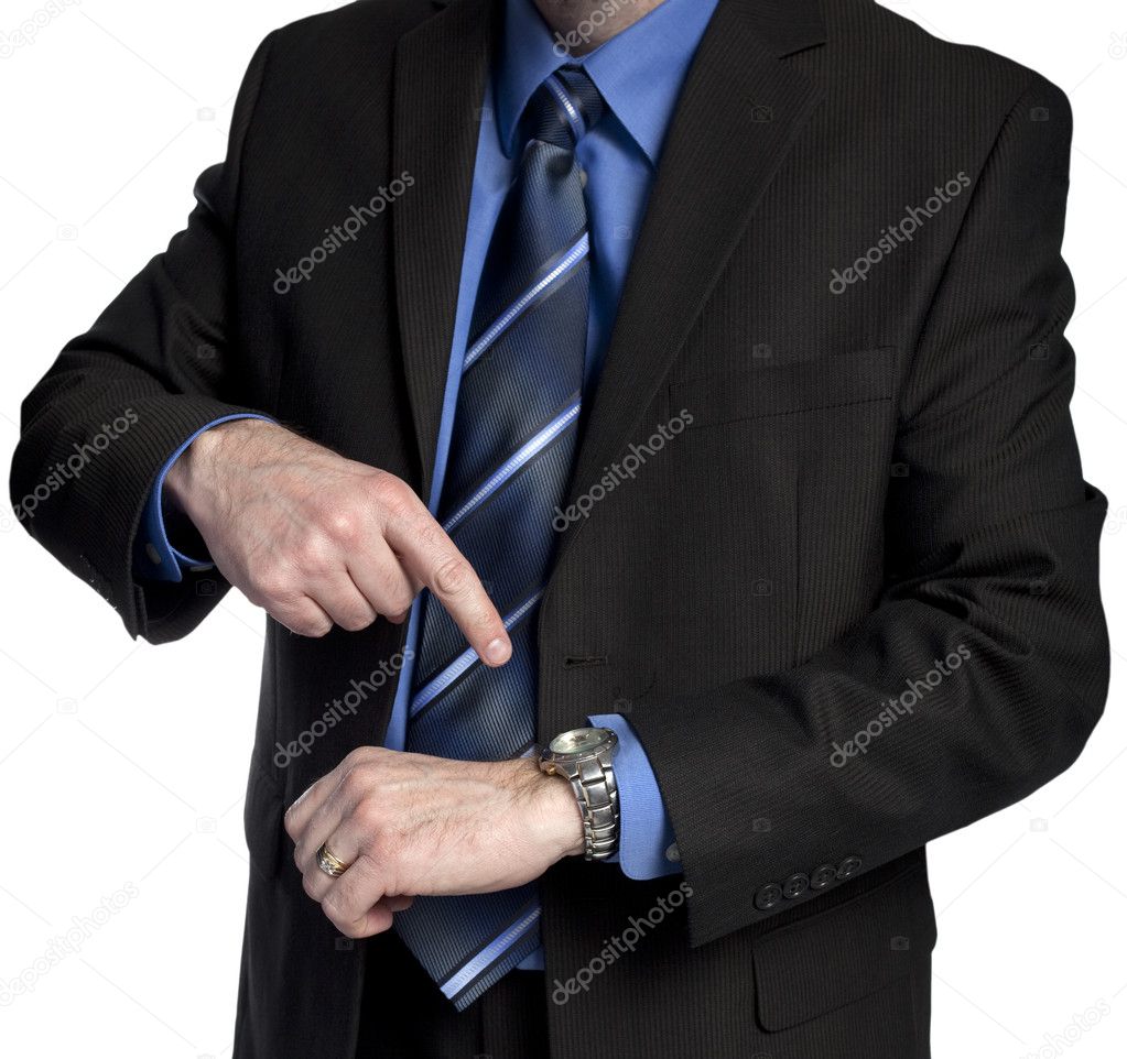 Businessman is pointing at his watch