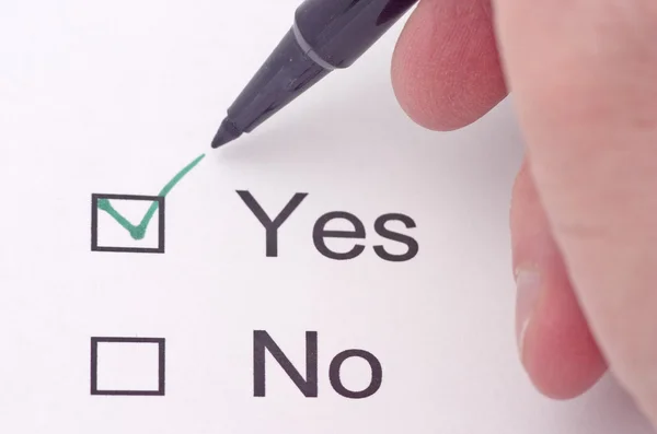 Close up of survey with check mark indicating yes — Stock Photo, Image