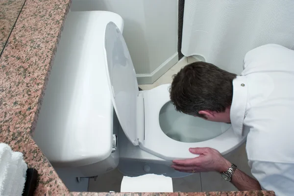 stock image Man throwing up in toilet bowl