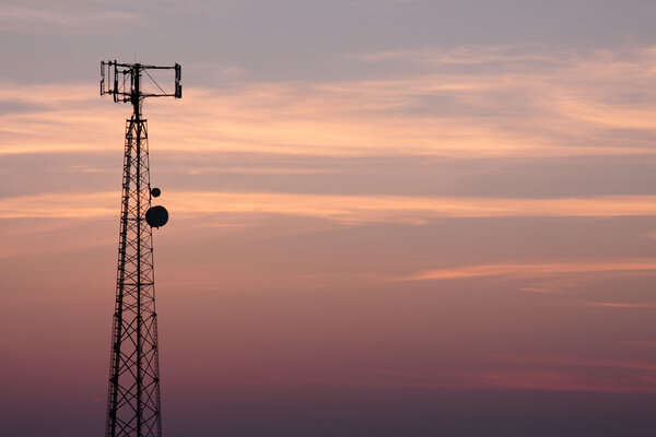 Cell Tower Silhouette Against the Pink Sky