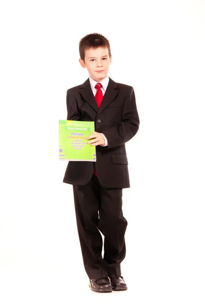 Garçon en costume officiel avec un livre — Photo