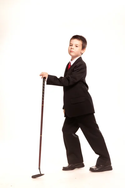 Boy in official dresscode with a golf club — Stock Photo, Image