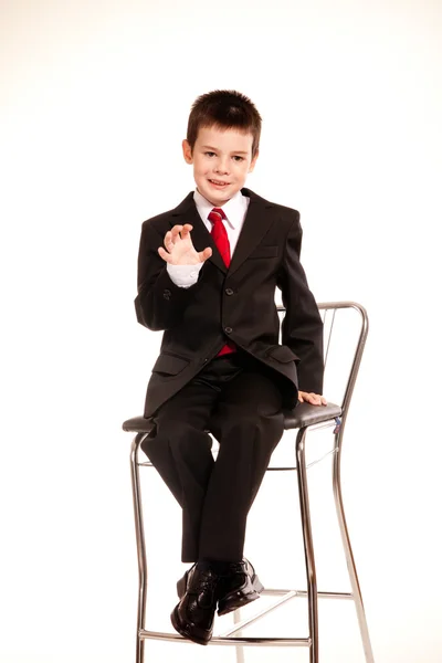 Boy in official dresscode with a cell phone — Stock Photo, Image