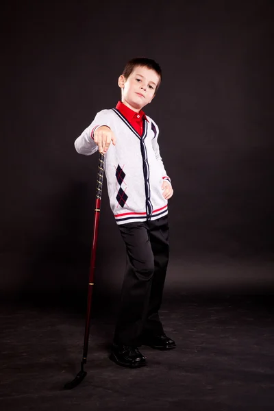 Boy in official dresscode with a putter — Stock Photo, Image