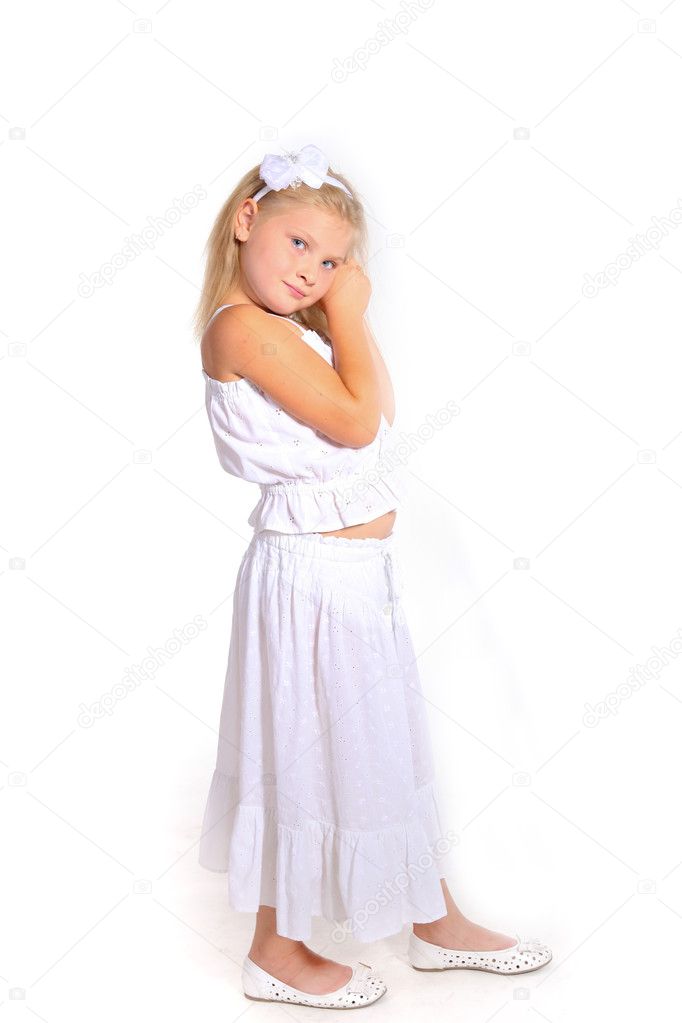 Young girl posing in studio on white