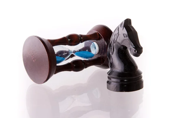 stock image Black chess horse with sand-clock