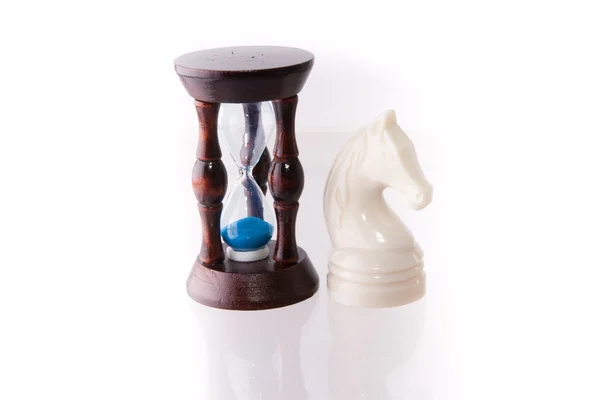 White chess horse with sand-clock — Stock Photo, Image