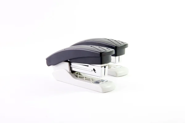 Composition of two identical office staplers — Stock Photo, Image