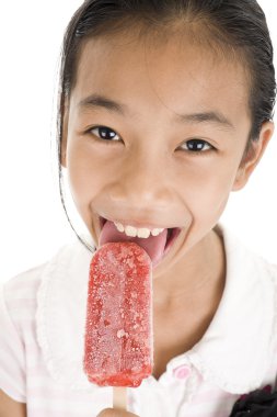 Happy girl licking ice cream clipart