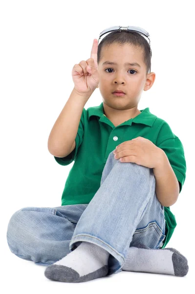 Boy with one finger raised — Stock Photo, Image