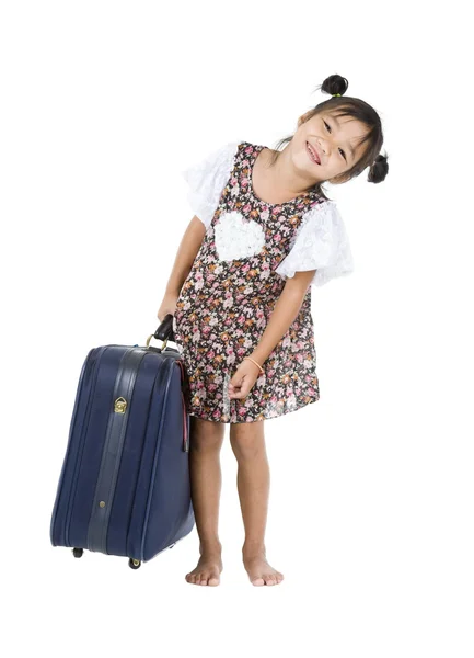 Happy Asian girl with heavy luggage — Stock Photo, Image